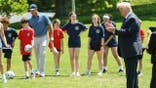 President Donald Trump joins young athletes exercising in the Oval Office.