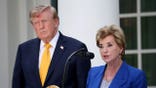 President Donald Trump and Secretary of Education Linda McMahon stand in the White House Rose Garden.