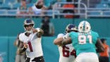Tua Tagovailoa passes during an NFL preseason game between the Falcons and Dolphins.