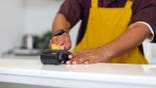 Clerk swipes customer credit card