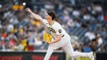 Walker Buehler delivers a pitch during the first inning at Petco Park.