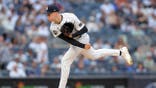 Will Warren, New York Yankees starting pitcher, follows through on a pitch at Yankee Stadium.