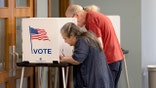 Voters at the voting booth.