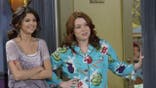 Selena Gomez and Jennifer Stone stand together in a scene from Wizards of Waverly Place.