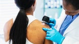 Woman at dermatologist