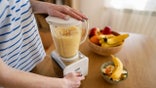 Woman making banana smoothie