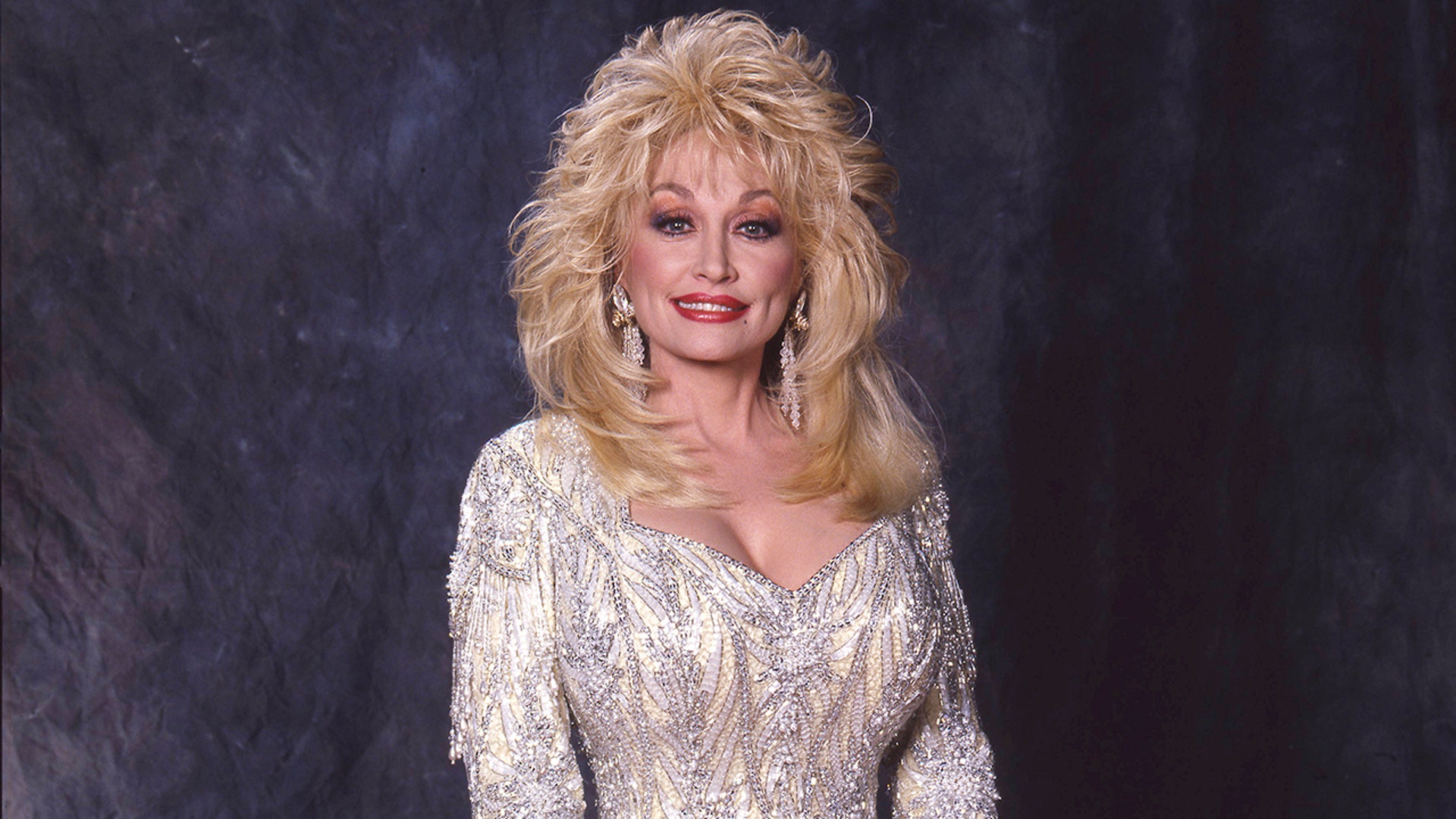 Dolly Parton in white in 1988.
