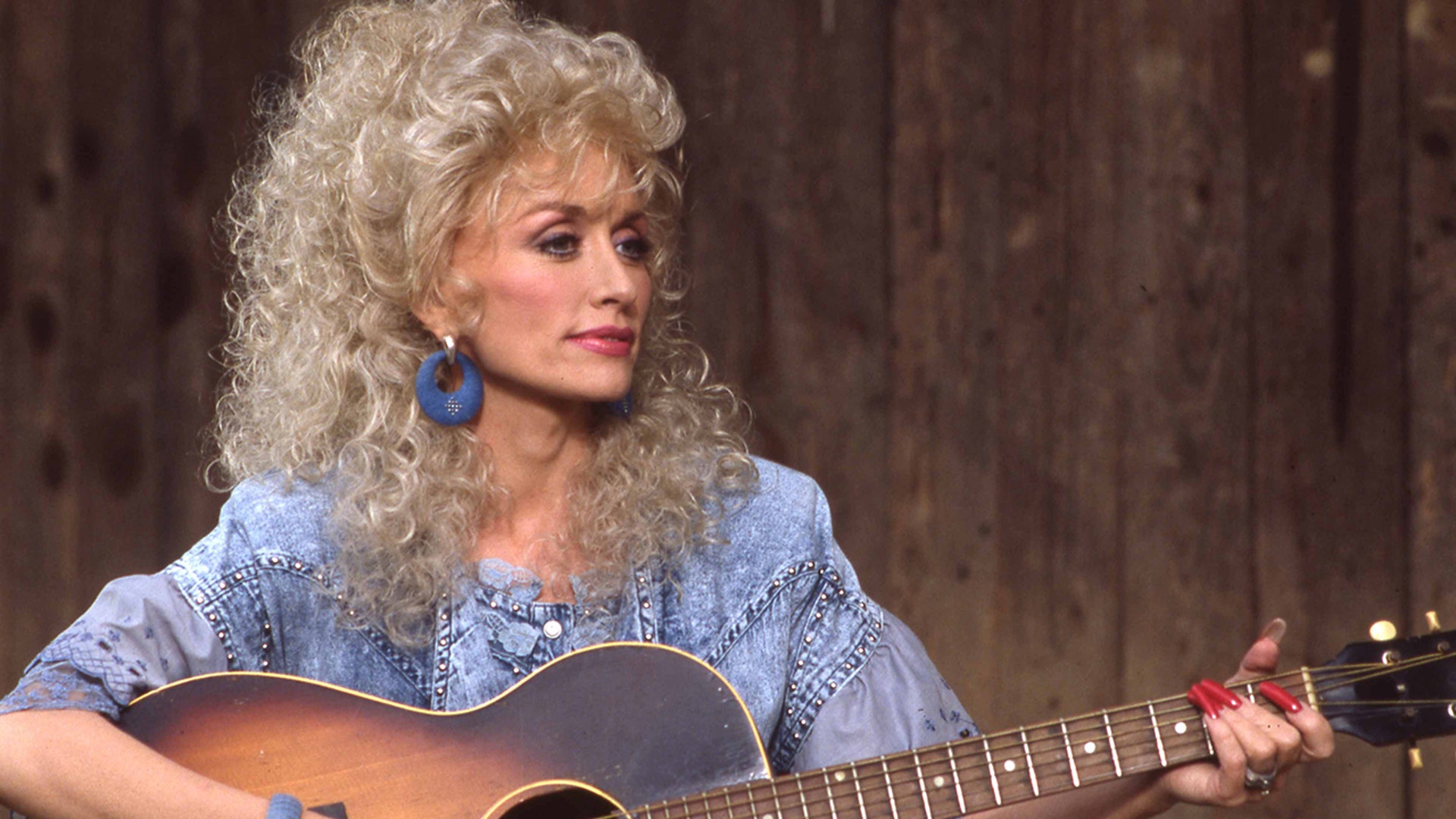 Dolly Parton in 1987 wearing blue.