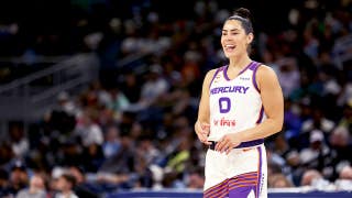 Social media explodes as WNBA star Kelsey Plum leaps into the arms of opposing coach during play