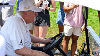 Trump rolls through his own club in a cart and gets a roaring ovation - Fox News