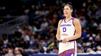 Social media explodes as WNBA star Kelsey Plum leaps into the arms of opposing coach during play