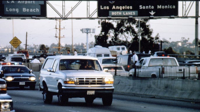 O.J. Simpson in a white Ford Bronco during a slow-speed chase on the 405 freeway in Los Angeles.