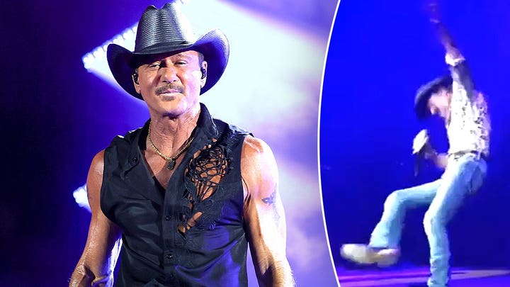 Tim McGraw falls onstage during concert