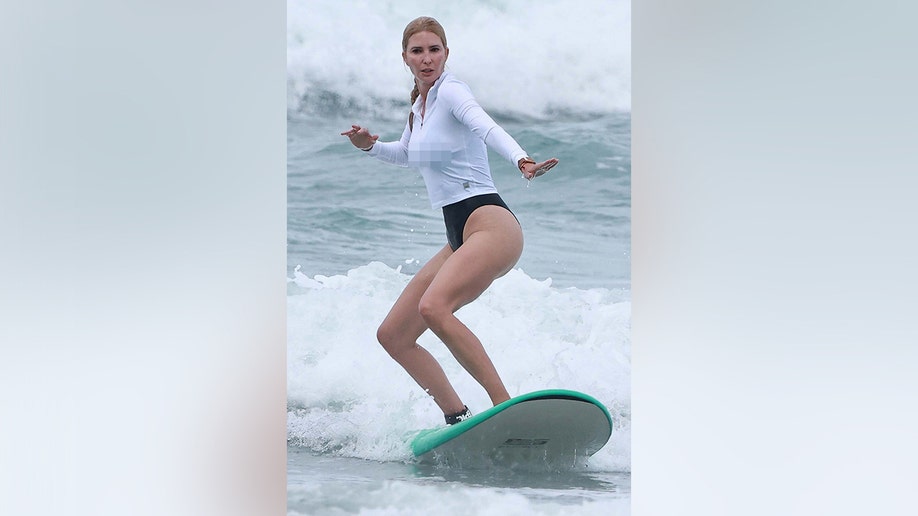 Ivanka steadied herself with her arms as she surfs in Costa Rica.