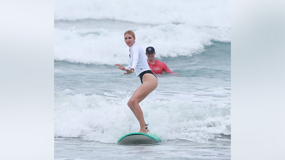 Ivanka showed off her athletic prowess as she surfed the waves in Costa Rica.