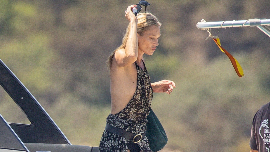 Kate Moss in a cover-up with a halter neckline.