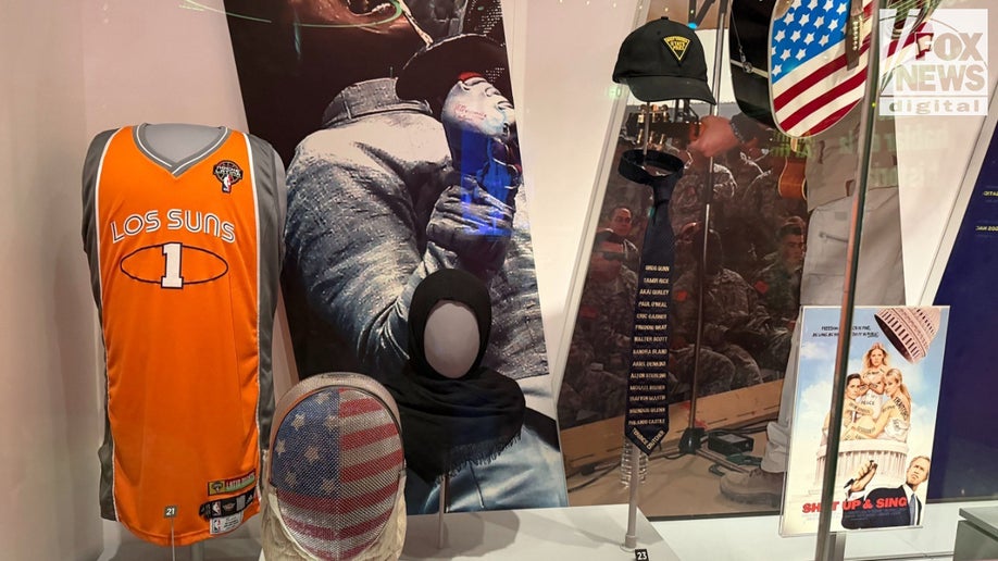 Objects representing various progressive athletes, including a tie bearing the names of slain African Americans, are displayed at the National Museum of American History. (Robert Schmad/Fox News Digital)