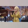 Dolly Parton in a sparkling gold dress in 2011.