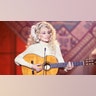 Dolly Parton on stage in white in 1978.