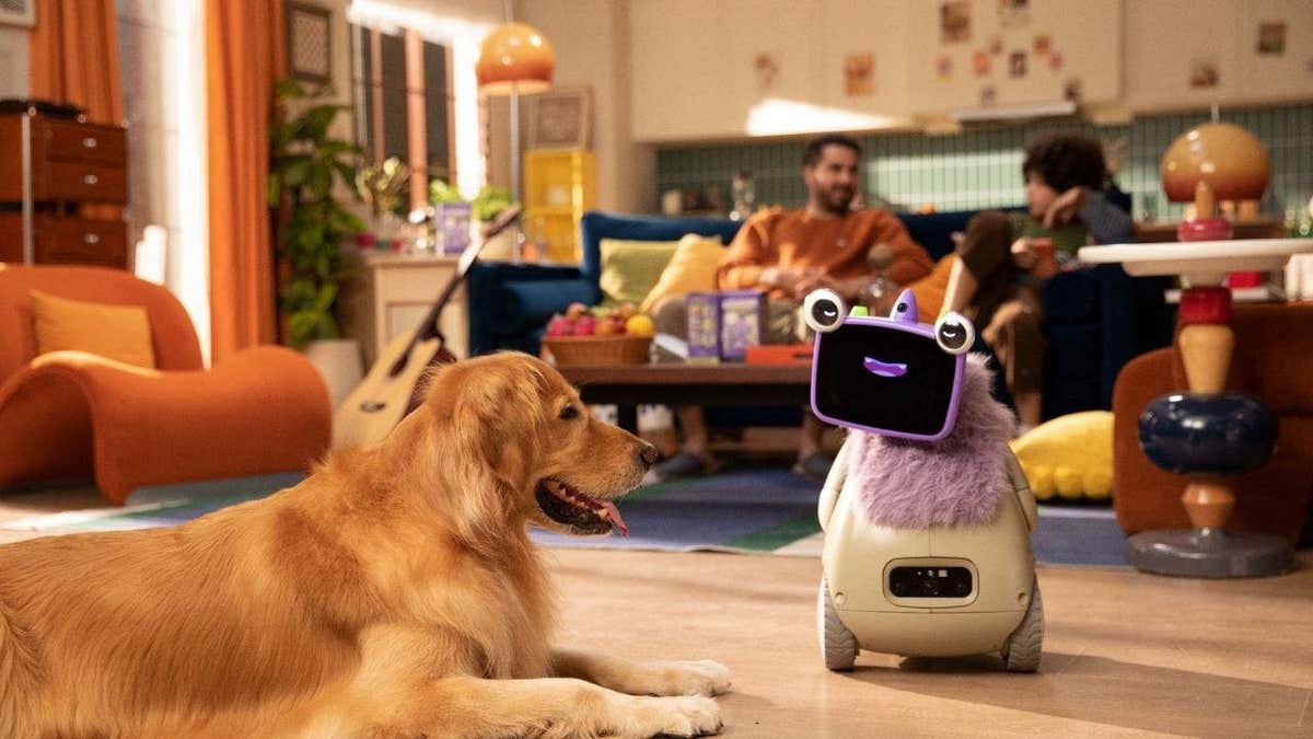 A dog laying down with a robot.