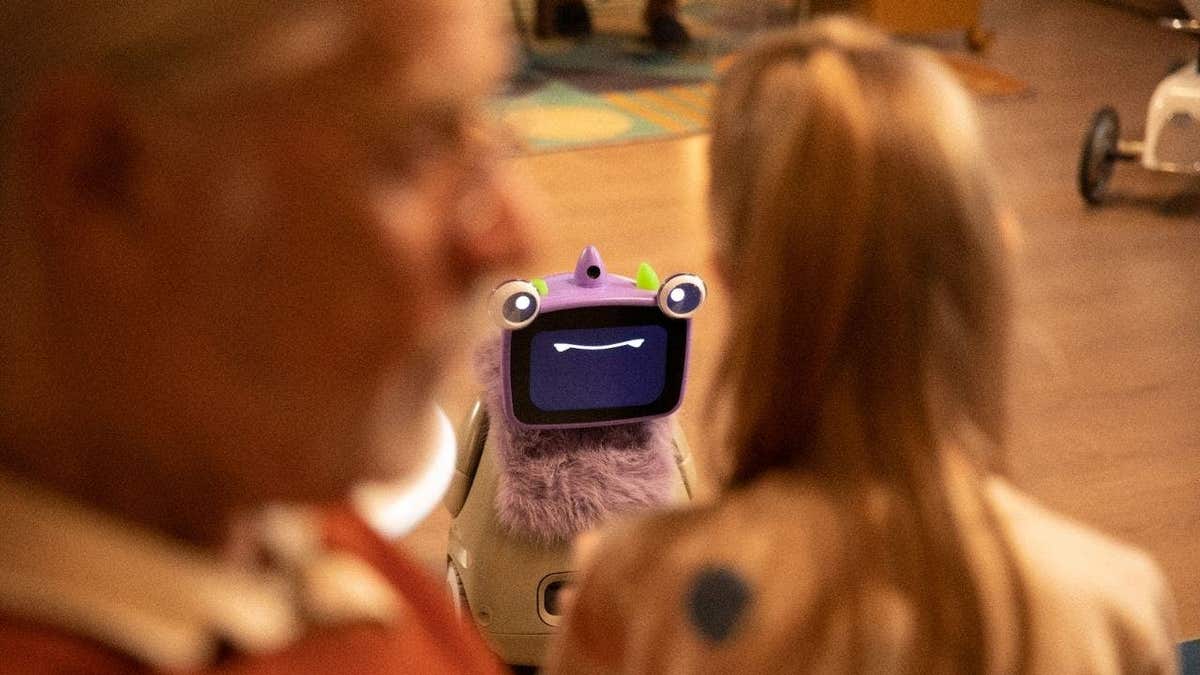The OlloBot interacting with a family.