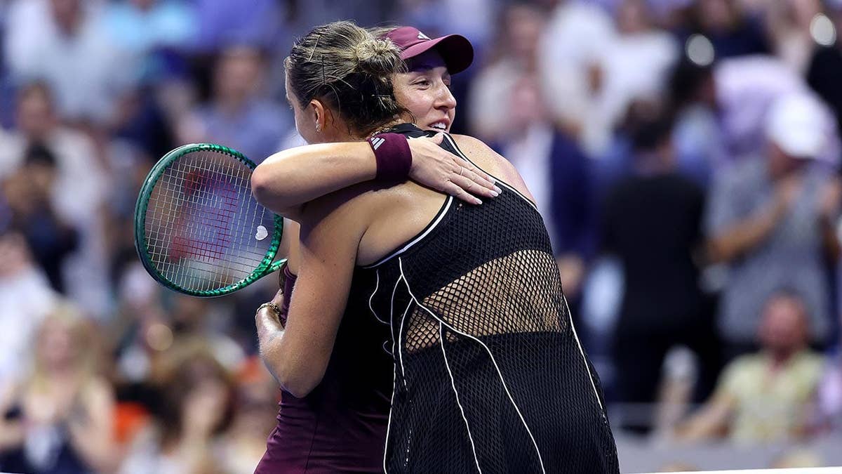 Aryna Sabalenka embracing Jessica Pegula after their women's singles semifinal match