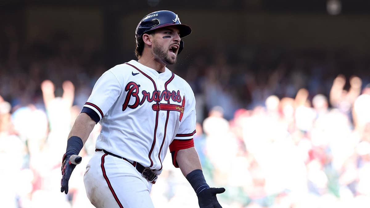 Austin Riley reacts after hitting a home run at Truist Park