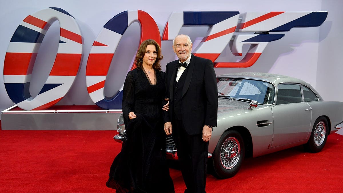 Barbara Broccoli and Michael G. Wilson stand at the World Premiere of No Time to Die.