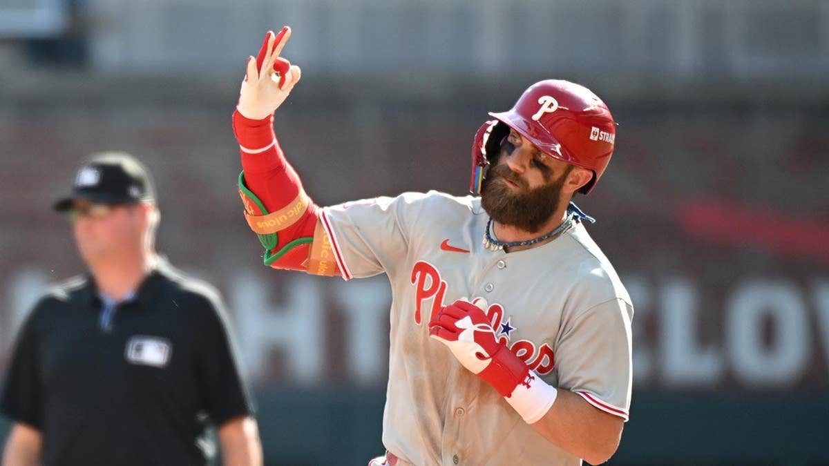 Bryce Harper rounds the bases after hitting a home run