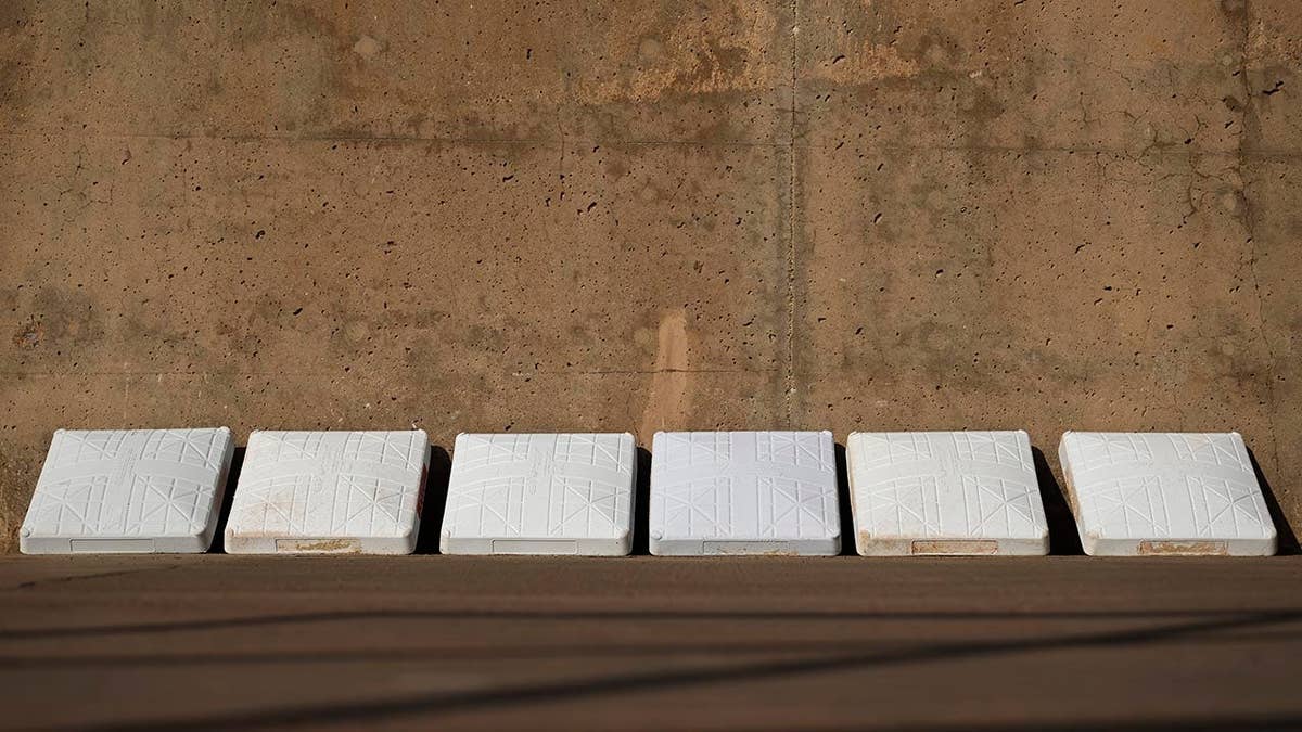 Bases on a softball field before a college softball game