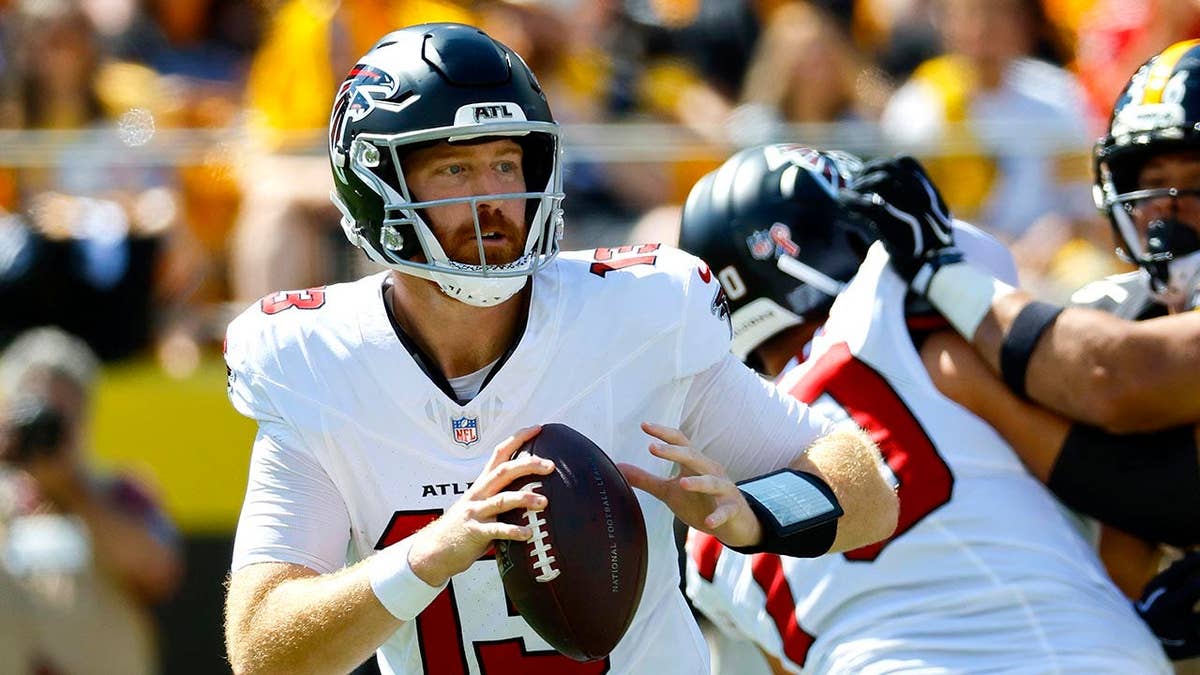 Cooper Rush throwing a pass against Pittsburgh Steelers
