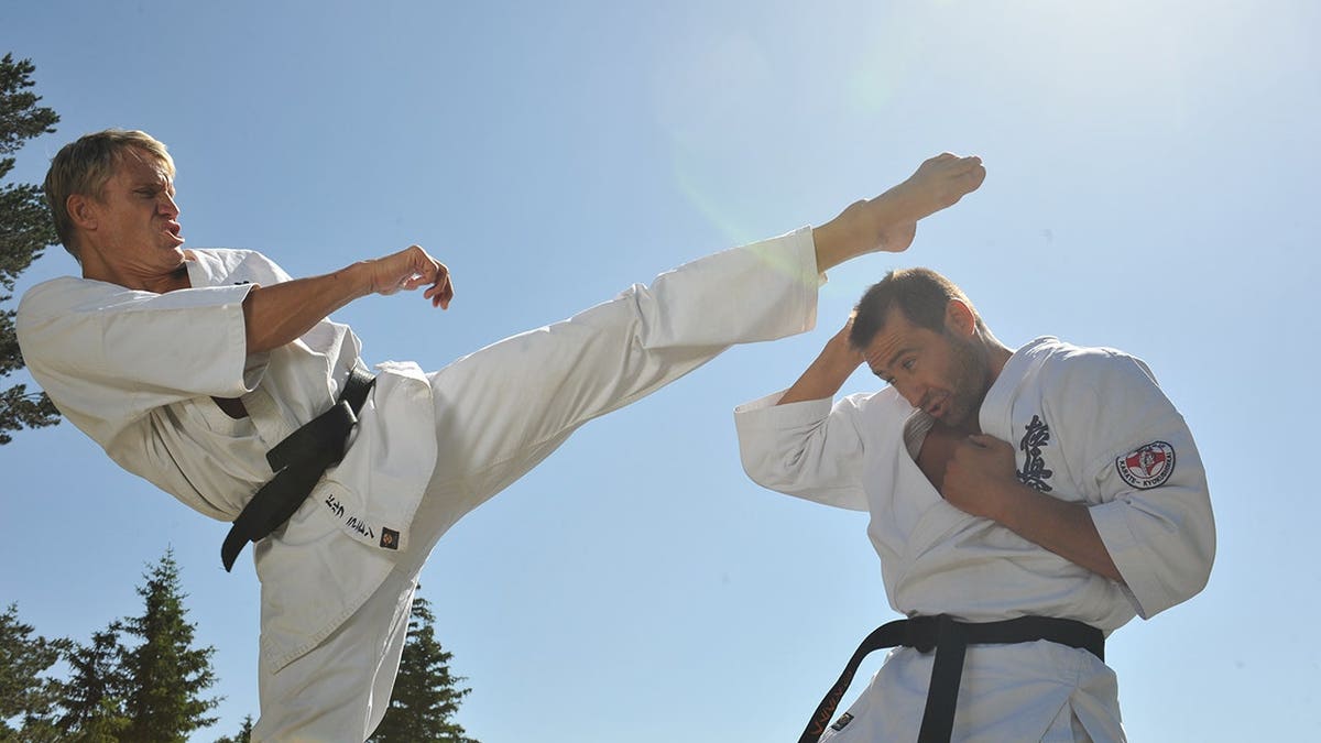 Dolph Lundgren poses during a martial arts event.