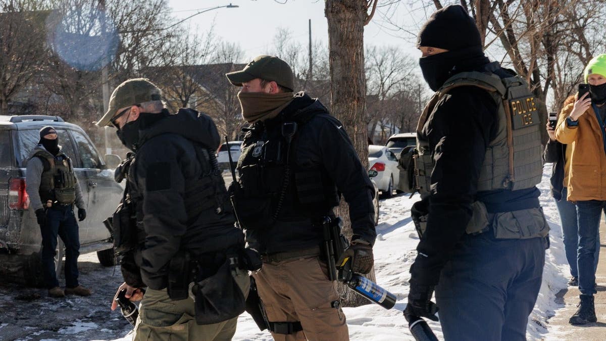 Immigration and Customs Enforcement (ICE) agents conduct immigration enforcement operations in Minneapolis