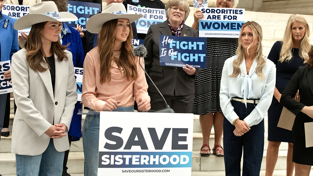 Plaintiff Hannah Holtmeier speaks outside federal court in Denver.