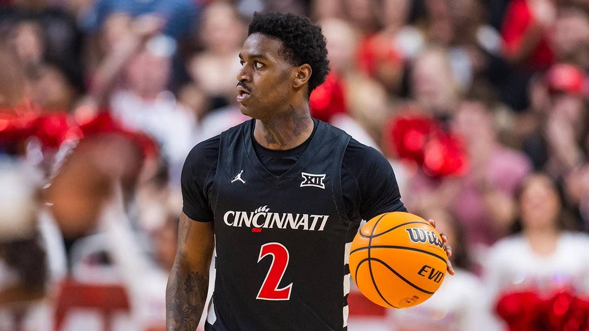 Jizzle James handle the ball during a college basketball game