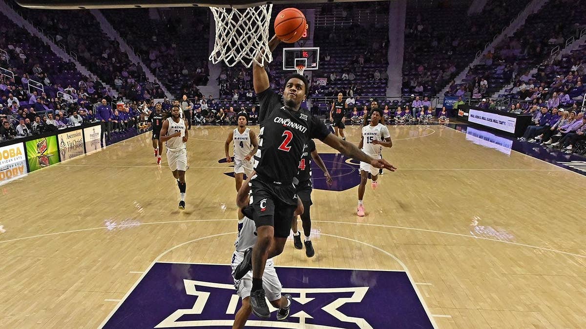 Jizzle James dunks the ball during a Cincinnati basketball game