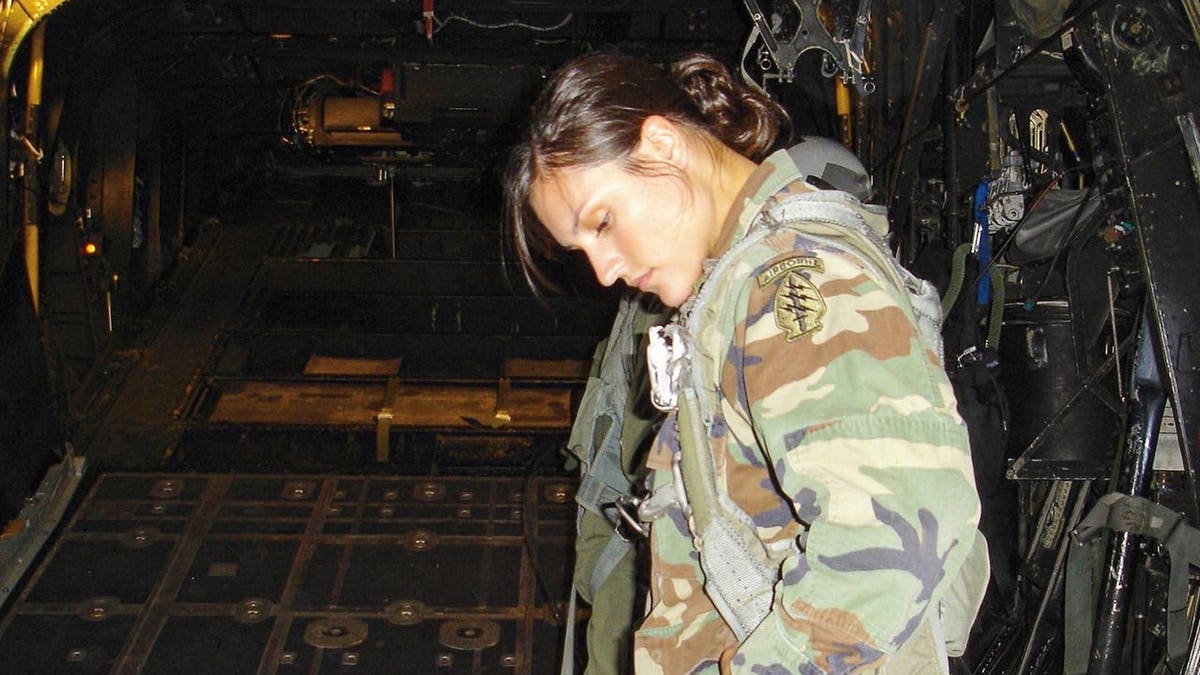 Lindsey Schmidt in Army wear looking away from the camera.