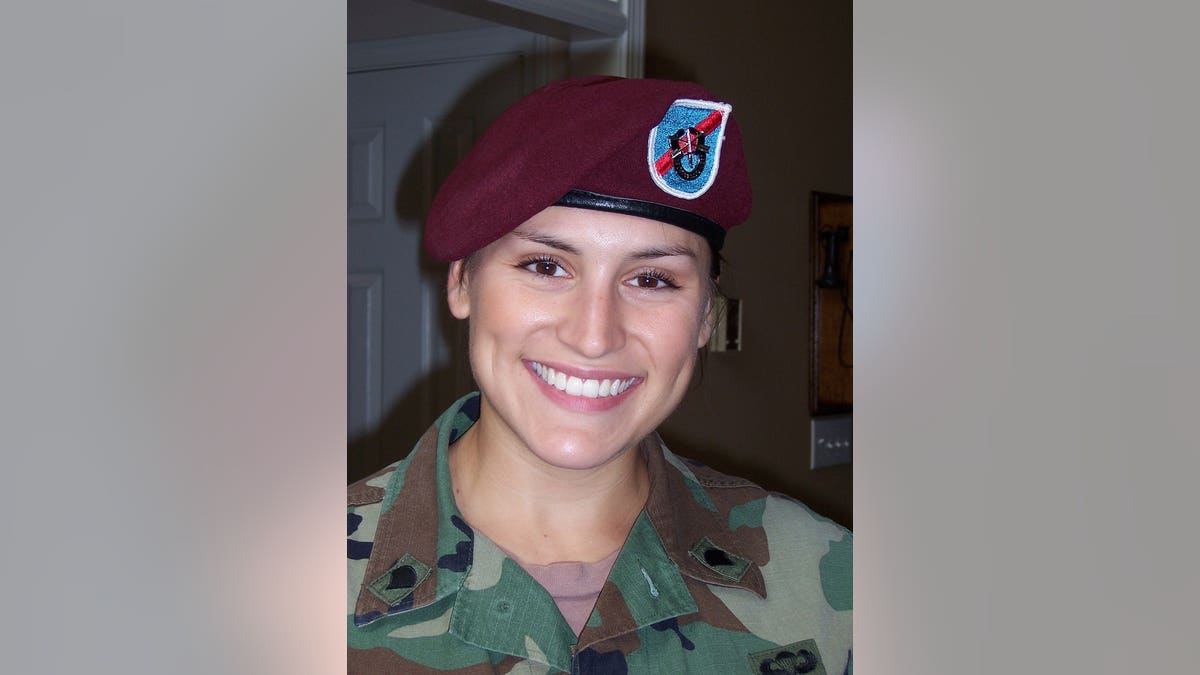 Close-up of a smiling Lindsey Schmidt in uniform.