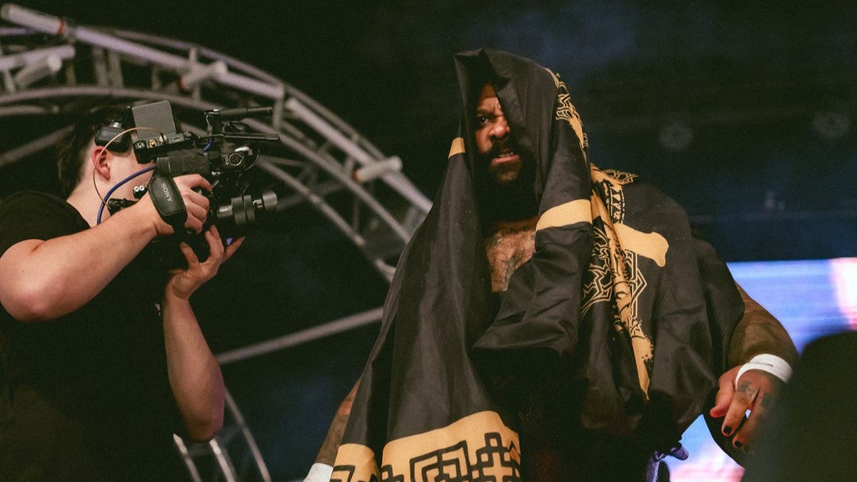 Brick Savage walks to the ring