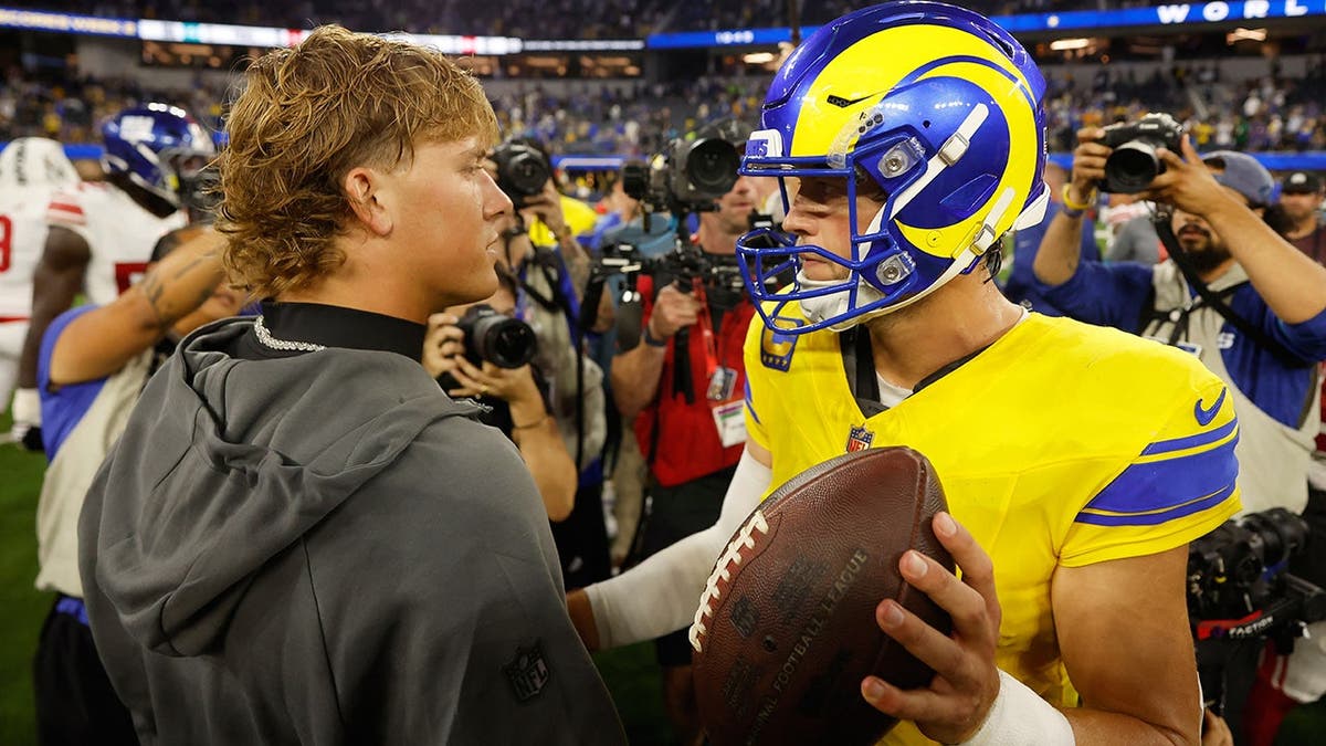 Jaxson Dart and Matthew Stafford shake hands after an NFL game in Inglewood, Calif.