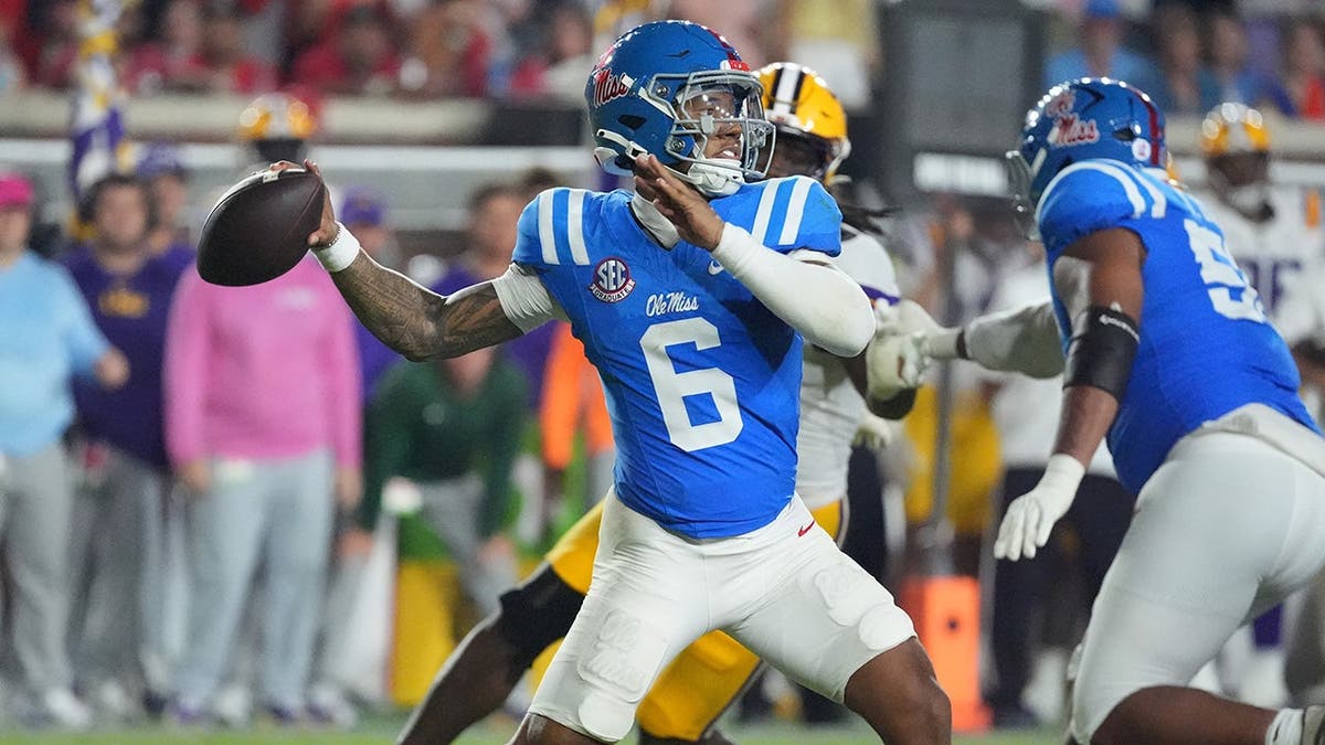 Trinidad Chambliss passes during a college football game in Oxford, Miss.