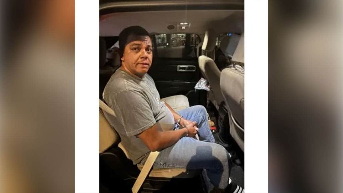Oscar Evaristo Nunez seated in a vehicle following his arrest by ICE in Virginia