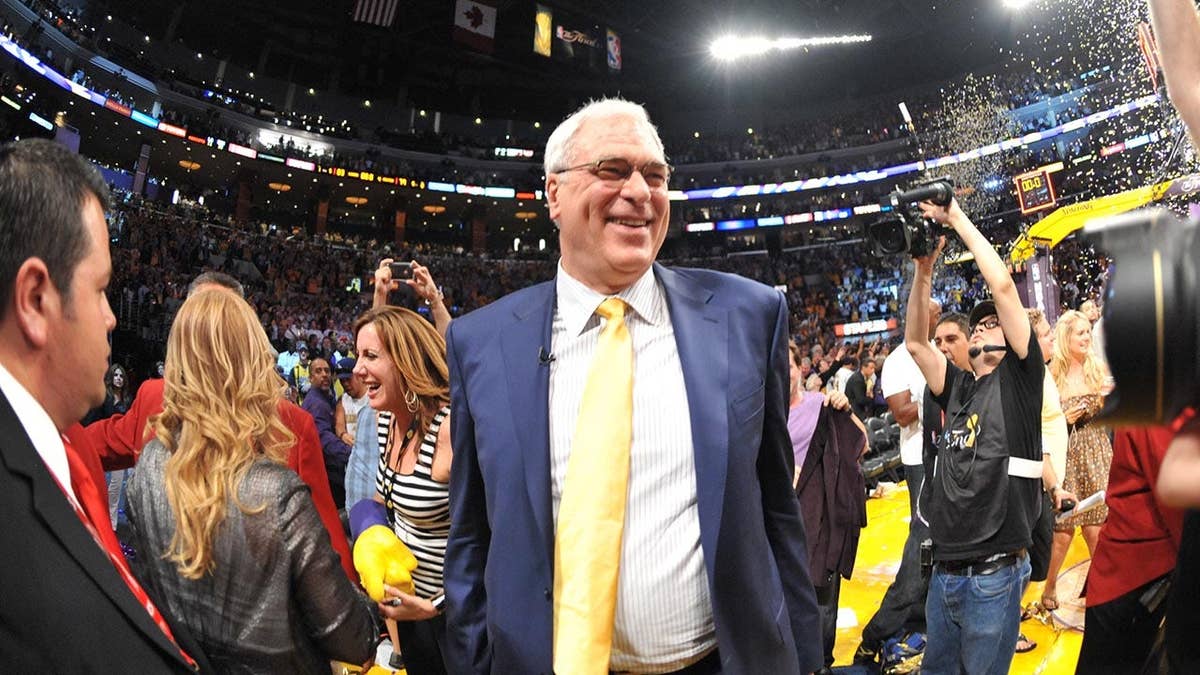 Phil Jackson celebrates after a Los Angeles Lakers win