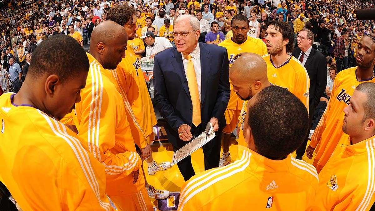 Phil Jackson directs a Los Angeles Lakers team huddle