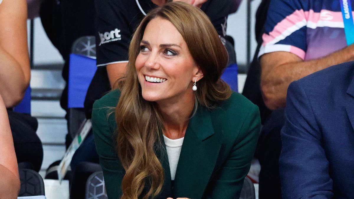 Kate Middleton smiling among a crowd during the Glasgow Commonwealth Games.