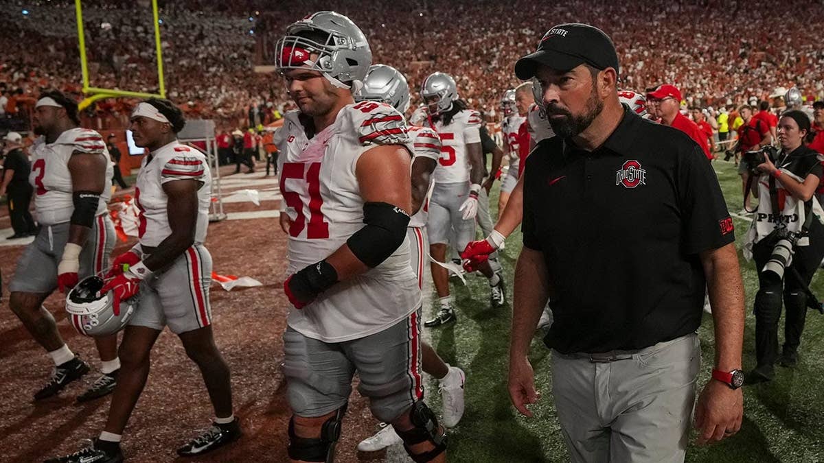 Ryan Day and Ohio State players leaving the field after a game