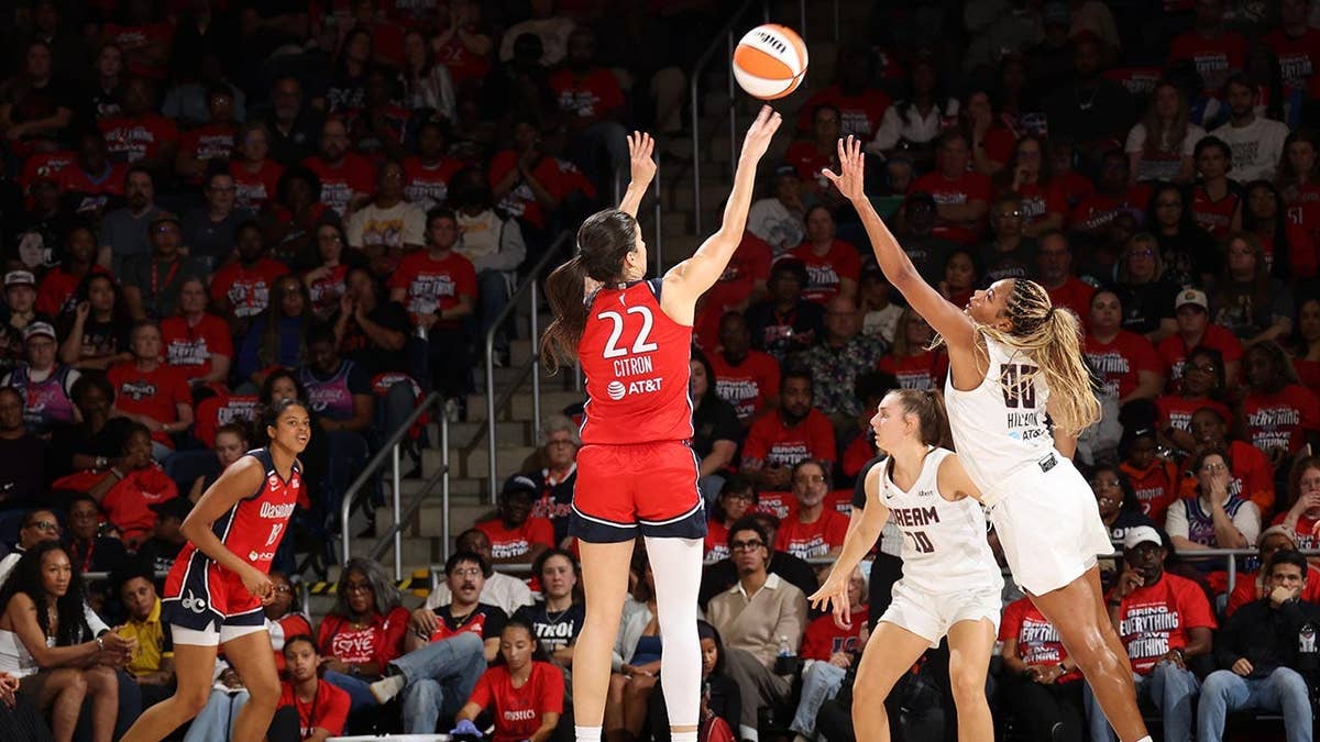 Sonia Citron attempts a three-point basket during a WNBA playoff game