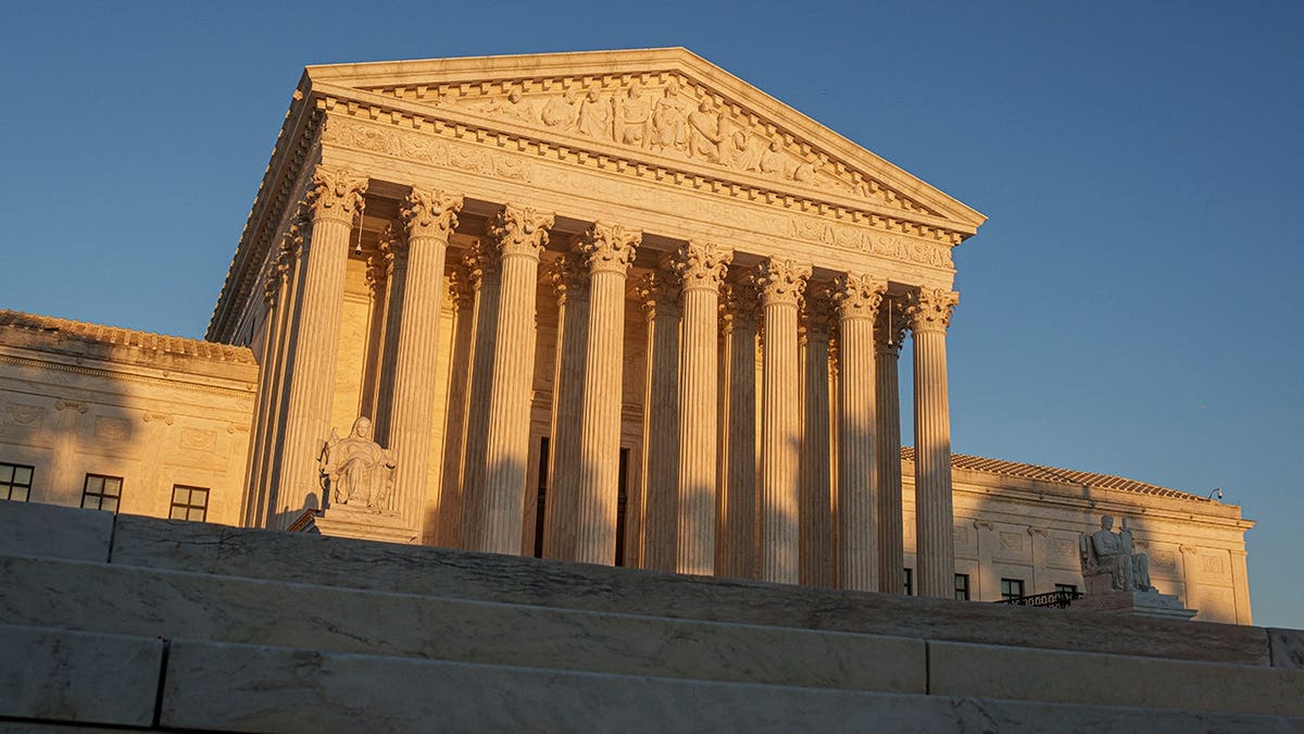 U.S. Supreme Court building glows in sunset light in Washington, D.C.