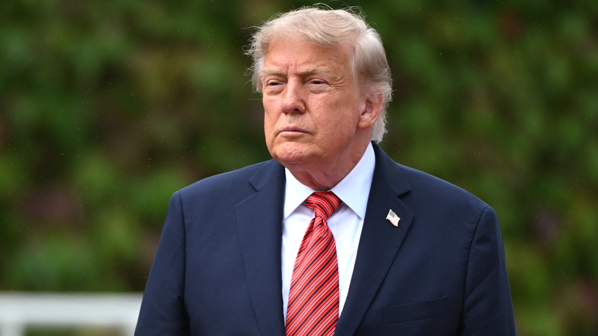 President Donald Trump stands outside Áras an Uachtaráin in Dublin.