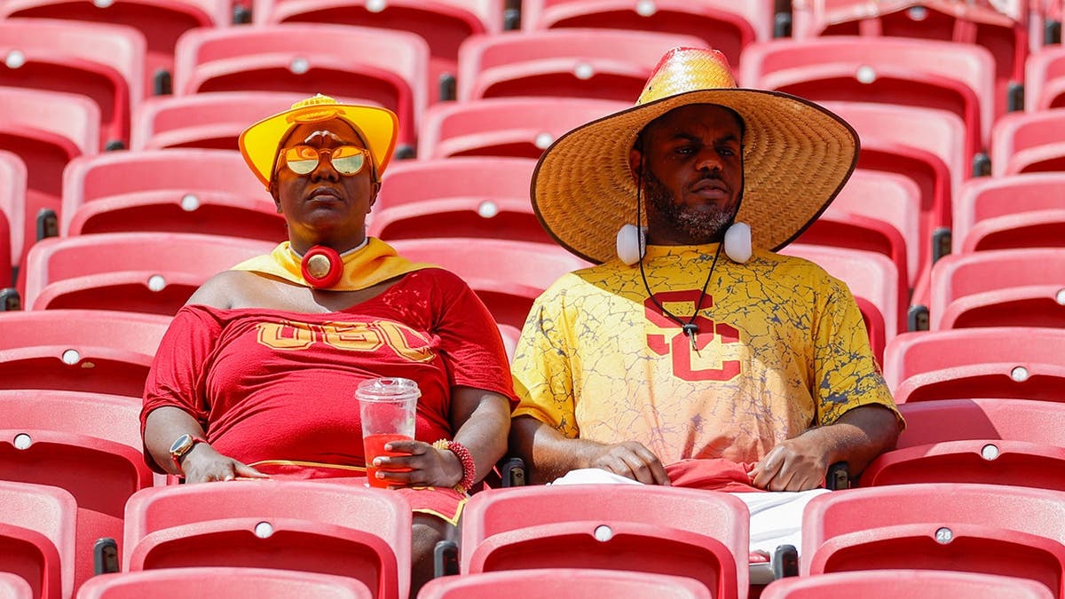 USC fans brace for the heat at Los Angeles Memorial Coliseum.
